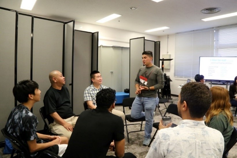 Cpl David Mendez, of CLR-37 Service Company on Camp Foster, Okinawa volunteers as MC during the Japanese Language Exchange with Camp Foster Library and the American Consulate. Photo credit: Aya Ichihashi, COMSTRAT